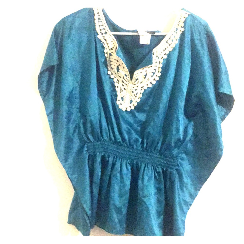 Shiny teal blouse, fitted at waist